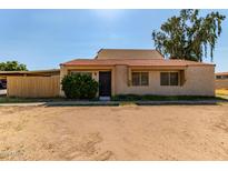 Cozy home featuring a classic tiled roof and a simple, welcoming facade at 4814 W Rose Ln, Glendale, AZ 85301