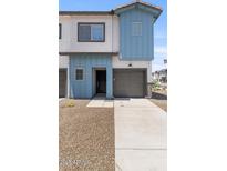 Charming townhome featuring a private garage and a contemporary architectural style at 7428 S 75Th Ln, Laveen, AZ 85339