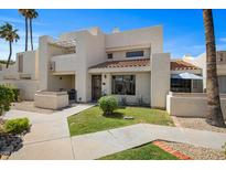 Inviting two-story home with a well-manicured lawn, front patio, and desert landscaping at 848 E Morningside Dr, Phoenix, AZ 85022