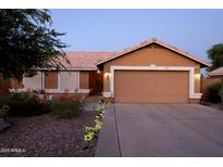 Charming single-story home with a well-maintained front yard and a two-car garage at 16011 N 35Th Dr, Phoenix, AZ 85053