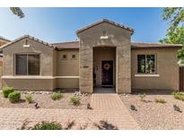 Inviting single-story home with a charming brick walkway leading to the front door at 1849 S Balboa Dr, Gilbert, AZ 85295