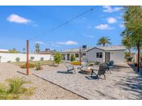 Beautiful backyard featuring a modern outdoor seating area and a well-manicured yard, perfect for entertaining at 1930 W Missouri Ave, Phoenix, AZ 85015