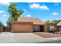 Charming single-story home with well-maintained landscaping and a two-car garage in a sunny neighborhood at 19648 N 8Th Pl, Phoenix, AZ 85024