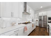 Gourmet kitchen with stainless steel appliances, stylish backsplash, and ample counter space at 21120 E Superstition Dr, Queen Creek, AZ 85142