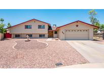 Charming two-story home with a well-manicured yard, fountain, and an attached two-car garage at 4414 S Ventura Dr, Tempe, AZ 85282