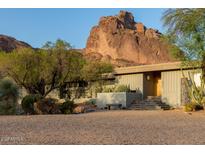 Stunning single-story home featuring desert landscaping with mountain views in the background at 5331 E Mcdonald Dr, Paradise Valley, AZ 85253