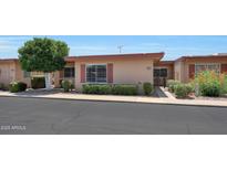 Charming single-story home with manicured landscaping and a welcoming facade at 13224 N 98Th Ave # L, Sun City, AZ 85351