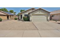 Charming single-story home featuring a two-car garage, low maintenance desert landscaping, and a neutral color palette at 21833 N 34Th Ave, Phoenix, AZ 85027