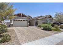 Charming single-story home with a three-car garage and a beautifully paved driveway, showcasing curb appeal at 2514 E Pleasant Ln, Phoenix, AZ 85042