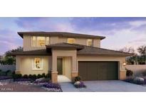 Beautiful two-story home featuring a two-car garage and well-manicured landscaping at 25360 W Bowker St, Buckeye, AZ 85326