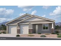 Charming single-story home featuring a symmetrical facade, dual garages, and stone accents, creating an inviting curb appeal at 2654 E Rustler Rd, San Tan Valley, AZ 85140