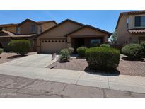Inviting single-story home with a two-car garage, well-maintained landscaping and a charming, covered entryway at 3545 W Glass Ln, Phoenix, AZ 85041
