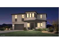 Inviting two-story home with a well-maintained lawn and an attached two-car garage at 35501 N Tin Ct, San Tan Valley, AZ 85144