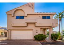 A charming two-story home with a two car garage, desert landscaping, and a unique architectural style at 6510 S Hazelton Ln # 101, Tempe, AZ 85283