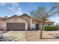 Charming single-Gathering home with a two-car garage and low-maintenance desert landscaping at 10702 W Orangewood Ave, Glendale, AZ 85307