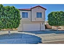 Charming two-story home with a two-car garage and well-maintained landscaping at 16029 W Ocotillo Ln, Surprise, AZ 85374