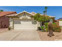 Inviting front exterior featuring a well-maintained landscape and a spacious two-car garage at 19546 N 53Rd Ave, Glendale, AZ 85308