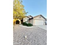Charming single-story home featuring a low-maintenance desert landscape and attached two-car garage at 22951 W Loma Linda Blvd, Buckeye, AZ 85326