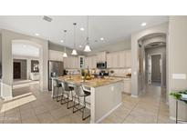 Bright eat-in kitchen featuring stainless steel appliances, granite countertops, and a large kitchen island at 4341 E Evelyn St, Gilbert, AZ 85295
