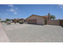 Single-story home with desert landscaping and a two-car garage at 7549 W Yucca St, Peoria, AZ 85345