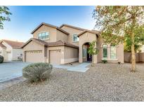 Charming two-story home featuring a three-car garage and well-maintained landscaping at 8621 W Morten Ave, Glendale, AZ 85305
