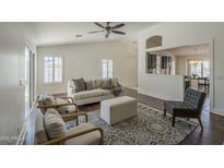 Bright living room featuring stylish furniture, ceiling fan, and an open view to the kitchen at 890 N Bogle Ct, Chandler, AZ 85225