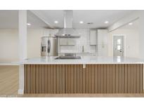 Bright kitchen with stainless steel appliances and large island at 2608 W Aster Dr, Phoenix, AZ 85029
