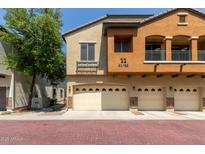 Charming townhome with a two-car garage and a well-maintained exterior with beautiful architectural details at 2727 N Price Rd # 32, Chandler, AZ 85224