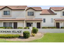 Inviting townhomes with well-manicured lawns and clay tile roofs create a charming exterior at 2986 N Oregon St # 7, Chandler, AZ 85225