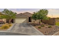 Charming single-story home featuring desert landscaping and a two-car garage at 37103 N El Morro Trl, San Tan Valley, AZ 85140