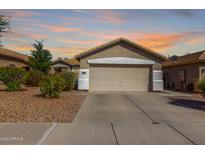 Charming single-story home with a two-car garage and well-maintained landscaping at 4251 E Sundance Ave, Gilbert, AZ 85297