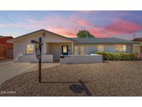 Charming single-story home featuring a low-maintenance front yard and a quaint, covered entrance at 7440 E Hubbell St, Scottsdale, AZ 85257