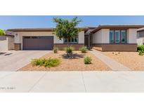 Charming single-story home featuring low-maintenance desert landscaping and a two-car garage at 1166 W Silver Creek Ln, Queen Creek, AZ 85140