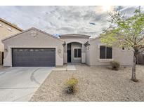 Charming single-story home with desert landscaping and a two car garage at 15853 N 74Th Ave, Peoria, AZ 85382