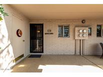 Inviting entrance with a secure black metal door and a cream brick wall that gives a welcoming feel at 16852 E La Montana Dr # C18, Fountain Hills, AZ 85268