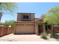 Two-story home with a neutral-colored stucco exterior, red tile roof, and a two-car garage at 17606 N 17Th Pl # 1096, Phoenix, AZ 85022
