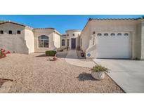 Charming single story home showcasing a manicured desert landscaped front yard and attached garage at 3125 W Desert Ln, Laveen, AZ 85339