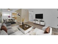 Bright living room featuring modern furnishings, decor, and a TV with a media console at 461 W Holmes Ave # 180, Mesa, AZ 85210