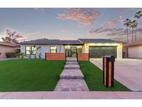 Charming single-story home with well-manicured lawn, striking a balance between modern style and curb appeal at 720 E Chilton Dr, Tempe, AZ 85283