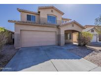 Charming two-story home featuring a two-car garage and covered entryway in a well-maintained community at 9939 W Southgate Ave, Tolleson, AZ 85353