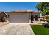 Charming single-story home with a well-manicured front yard and a spacious two-car garage at 10408 W Miami St, Tolleson, AZ 85353