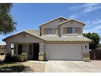 Charming two-story home with a well-maintained front yard and tile roof at 16784 W Polk St, Goodyear, AZ 85338