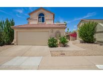 Two-story home with a two-car garage and desert landscaping in a residential neighborhood at 19230 N 5Th St, Phoenix, AZ 85024