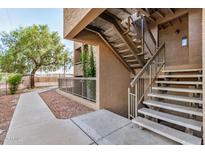 Exterior view of building with stairs and walkway at 2625 E Indian School Rd # 143, Phoenix, AZ 85016