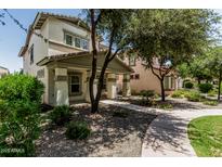 Charming two-story home with covered porch and landscaped front yard at 3037 E Hobart St, Gilbert, AZ 85296