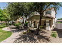 Charming two-story home with covered porch and landscaped front yard at 3037 E Hobart St, Gilbert, AZ 85296