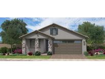 Charming single-story home with stone accents, a two-car garage, and beautiful landscaping at 35068 N Sacramento Wash Rd, San Tan Valley, AZ 85144