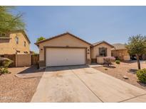 Charming single-story home featuring a two-car garage and low maintenance landscaping at 41767 W Somerset Dr, Maricopa, AZ 85138