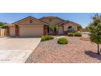 Charming single-story home with a well-manicured front yard and a two-car garage at 4307 E Shetland Dr, San Tan Valley, AZ 85140