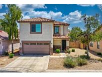 Two-story home featuring a neutral stucco exterior, terracotta roof, and a two-car garage at 1090 S Bogle Ct, Chandler, AZ 85286